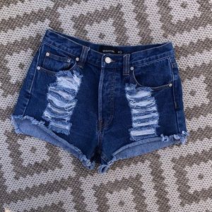 High waisted button up medium wash jean shorts